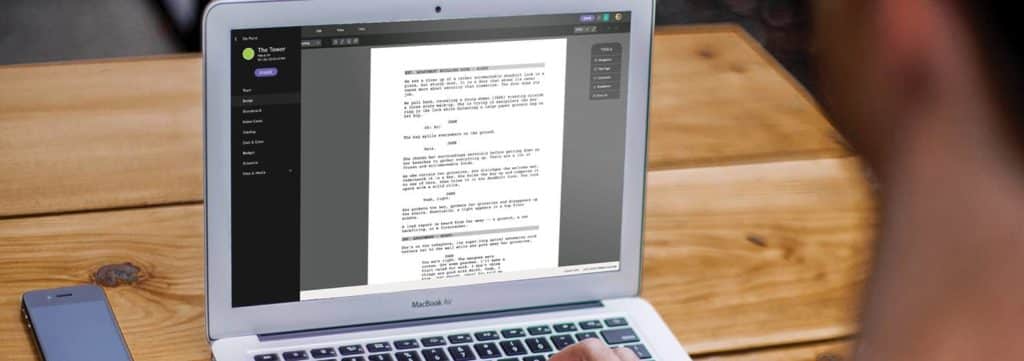 A laptop open with the script writing software Celtx on the screen, open to screenplay.