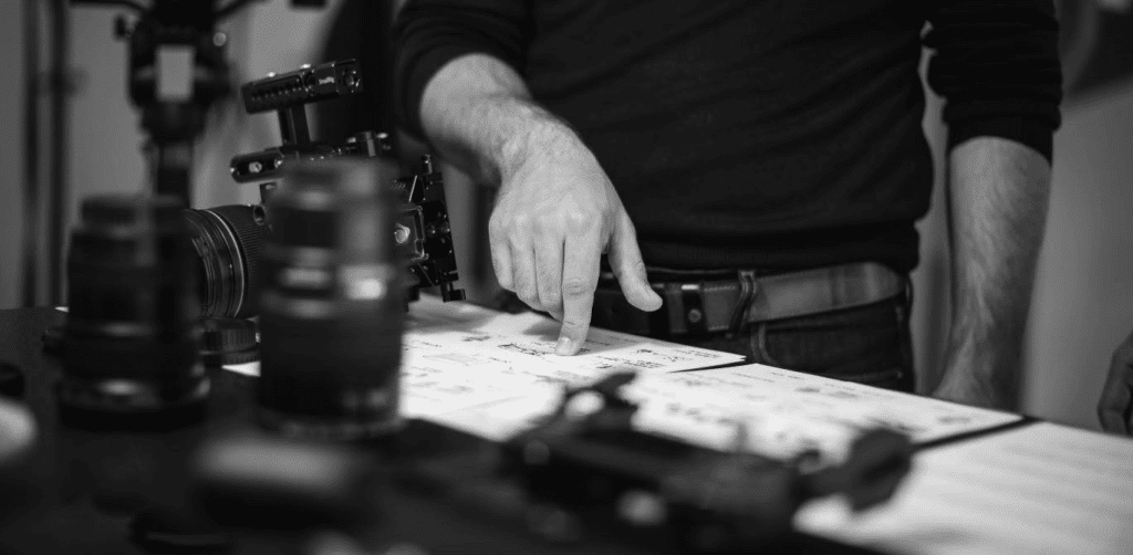A filmmaker works on a storyboard