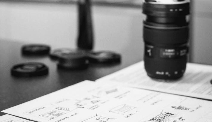 a storyboard with a camera lens