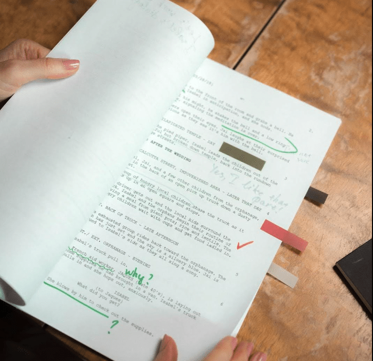 A script marked up with editing notes.