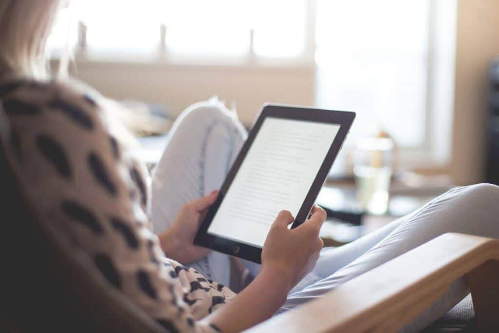 a woman reading a screenplay on an ipad. Download the Celtx Screenplay app for mobile and tablet today!