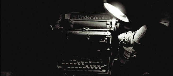 a dusty old typewriter with the name "Underwood" on it