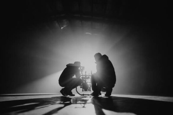 camera operators silhouetted