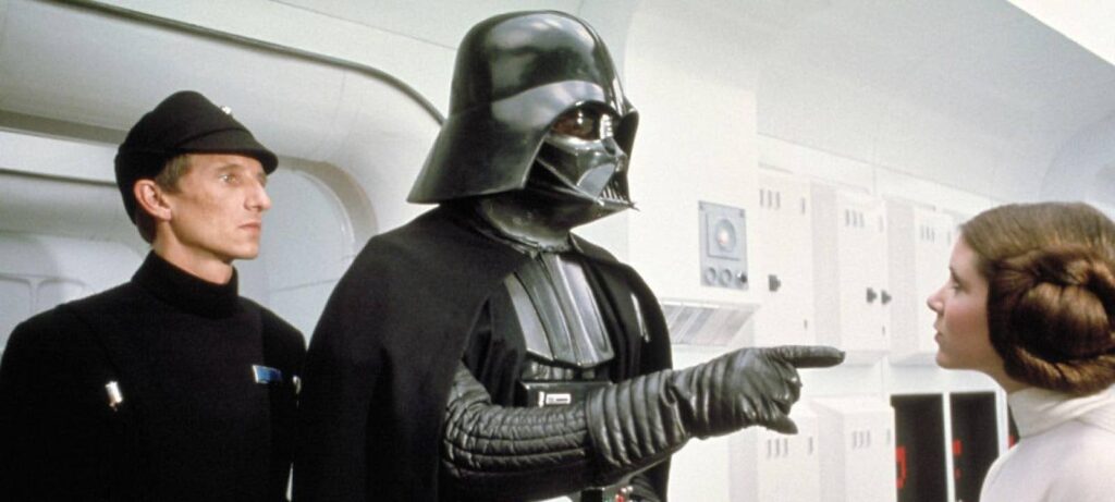 Darth Vader points a finger in Leia's face