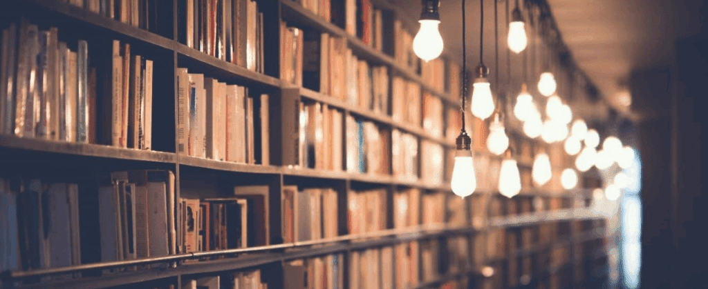 photo of a library with really cool hanging lights. Perfect for researching your documentary.