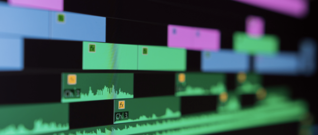 behind the scenes editing of an indie film. Levels of sound editing on a screen.