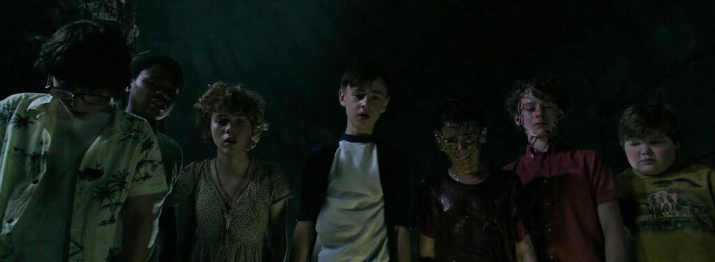The Losers Club (IT) look on. An example of character vs. supernatural, a type of external conflict.