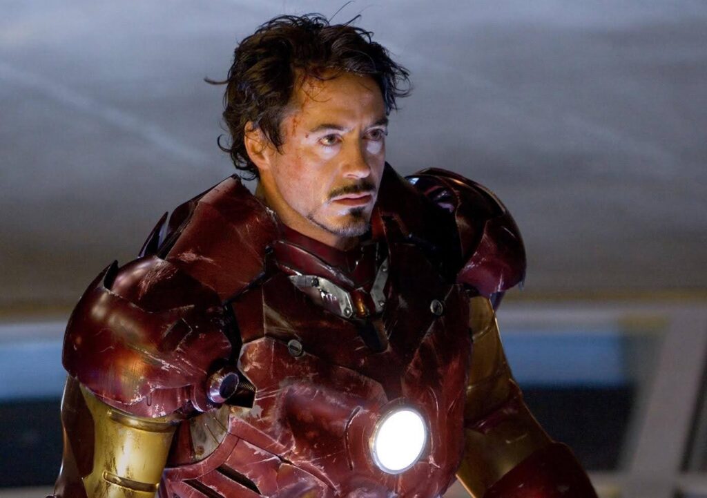 Iron Man becomes the selfless hero due to external conflict and internal growth