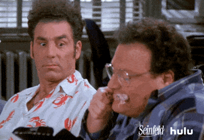 Newman from Seinfeld annoyingly eats a chicken wing