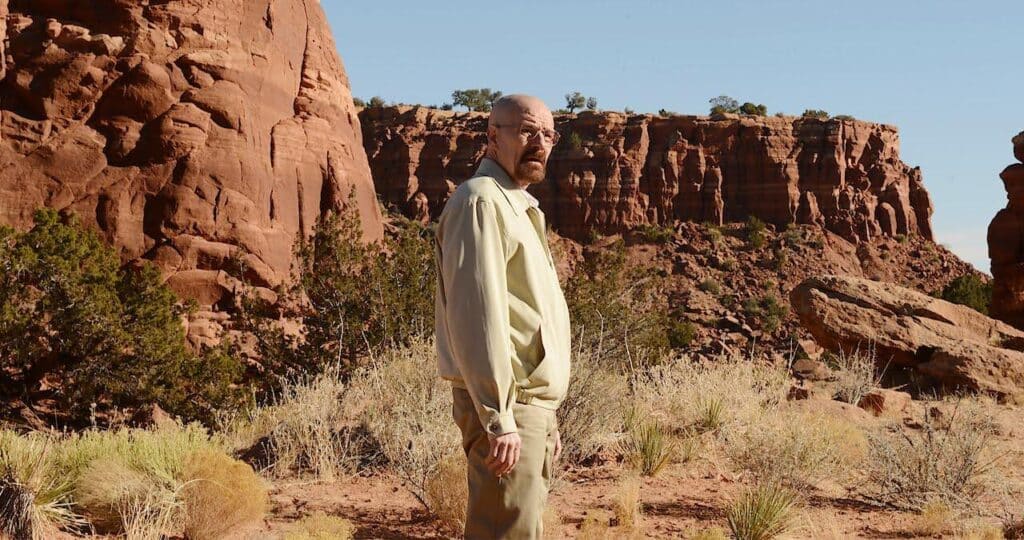 Walter White in Breaking Bad stands alone in the desert.