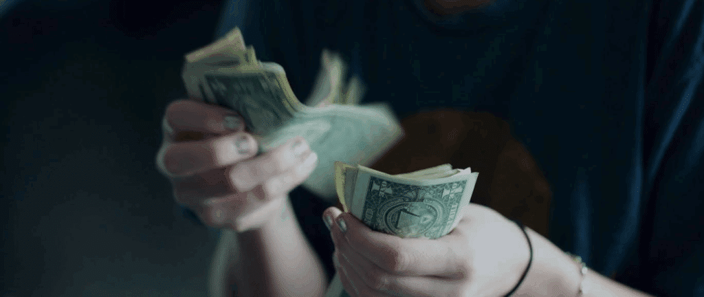 handfuls of one dollar bills (you'll certainly make more than this if you sell your spec script)