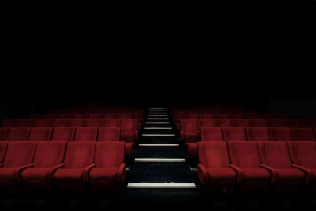 an empty movie theater in the dark. Kind of ominous.