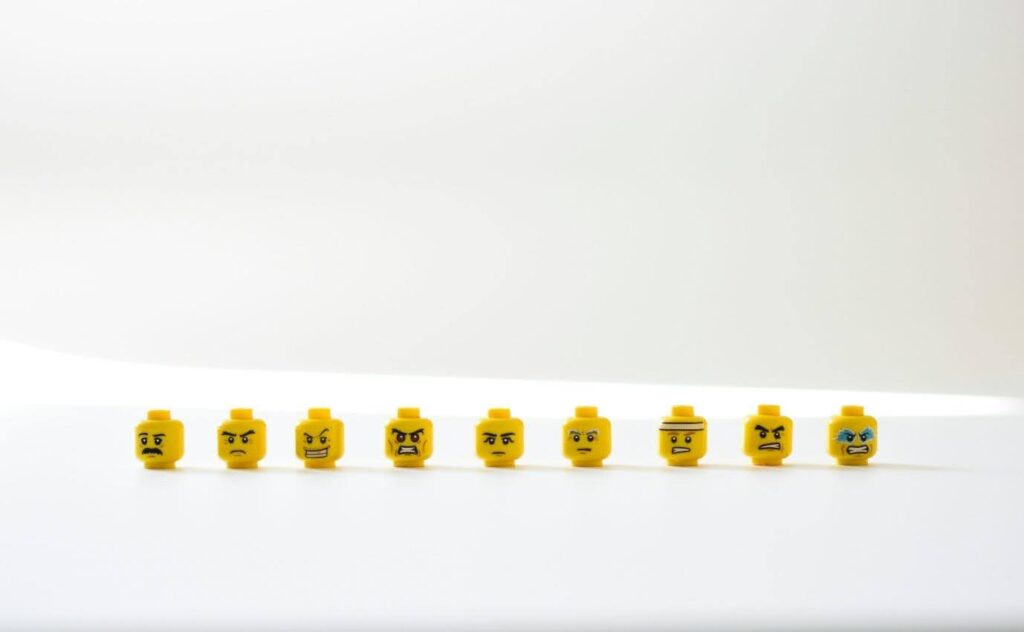 A photo showing a line of Lego heads, all with different emotions.