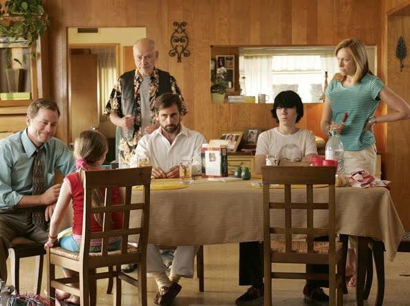 A still from the movie Little Miss Sunshine, showing the family sitting around the table with grim faces. Start writing your script today with Celtx - no download necessary!
