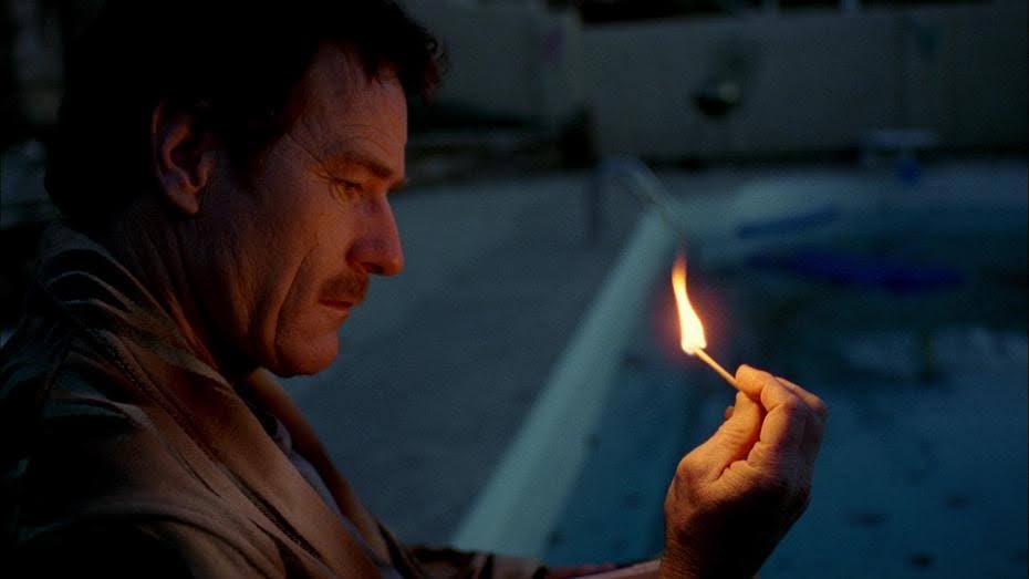 Walter White in AMC's Breaking Bad, staring at a lit match.