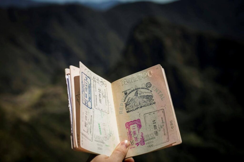 A photo of what appears to be a book with many stamps - perhaps a well-traveled passport.