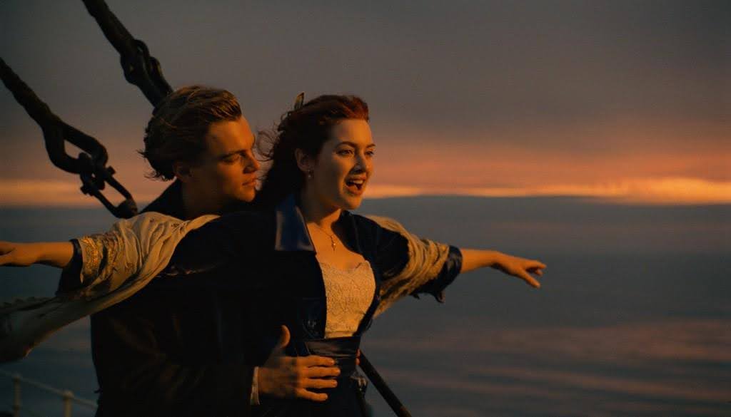 An example of dramatic irony in film: Titanic. This photo is the scene where Jack and Rose stand at the bow of the Titanic and Rose exclaims, "I'm flying, Jack!"