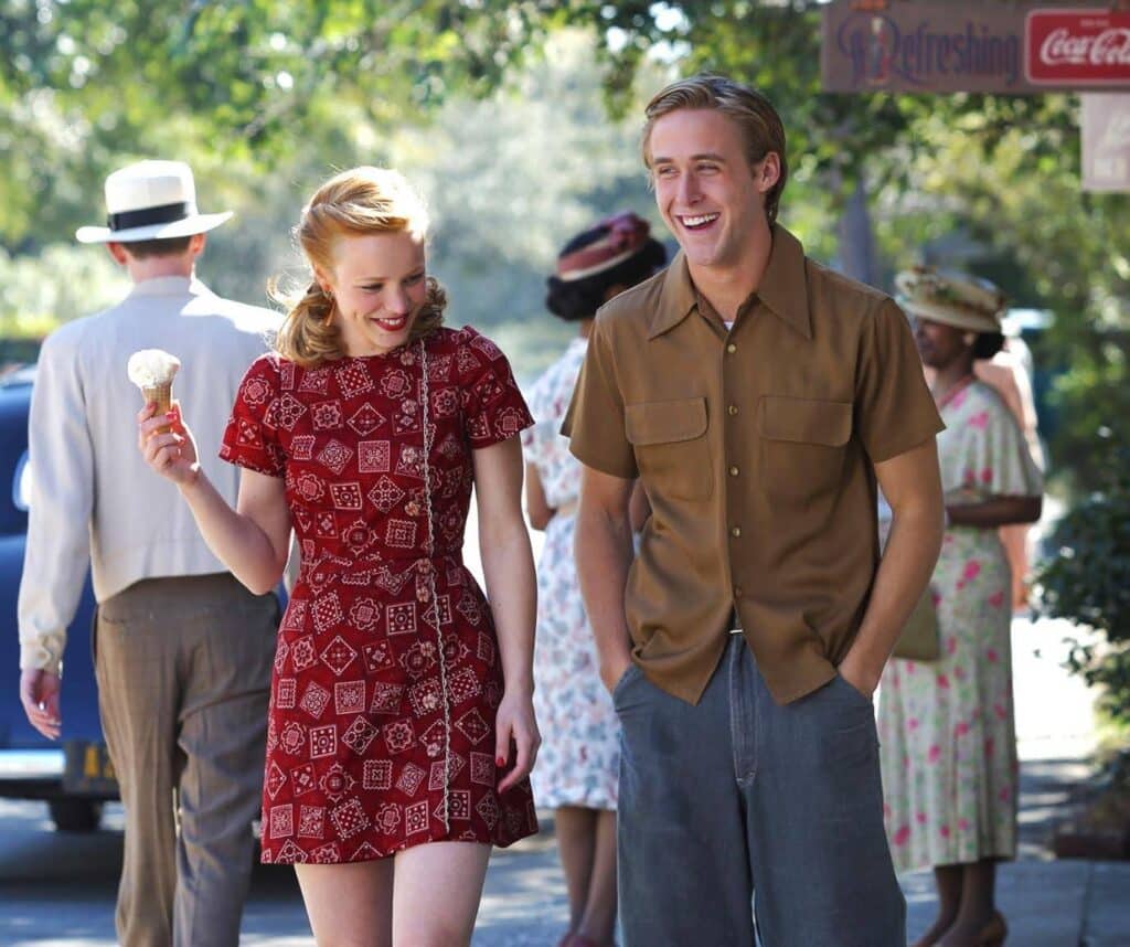 A still from the movie The Notebook showing Allie and Noah walking down the street. Allie is eating ice cream. Learn how to write a script with Celtx scriptwriting software