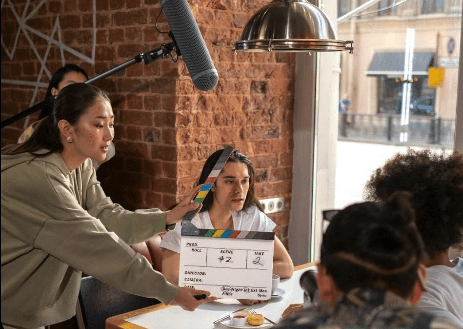 A scene about to be filmed - this is an example of diegetic sound: the audience will hear the sound recorded in this scene (a group of people sit at a table in a diner)