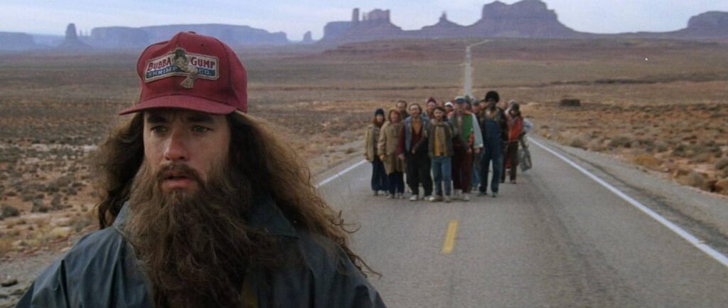 A still of Forrest Gump as he stops running.