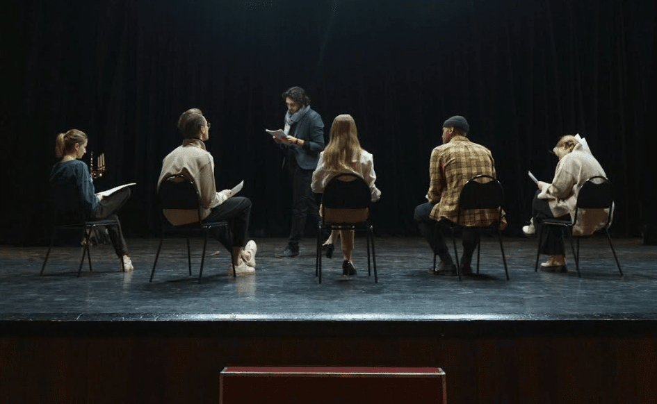 A cast uses script sides during rehearsal