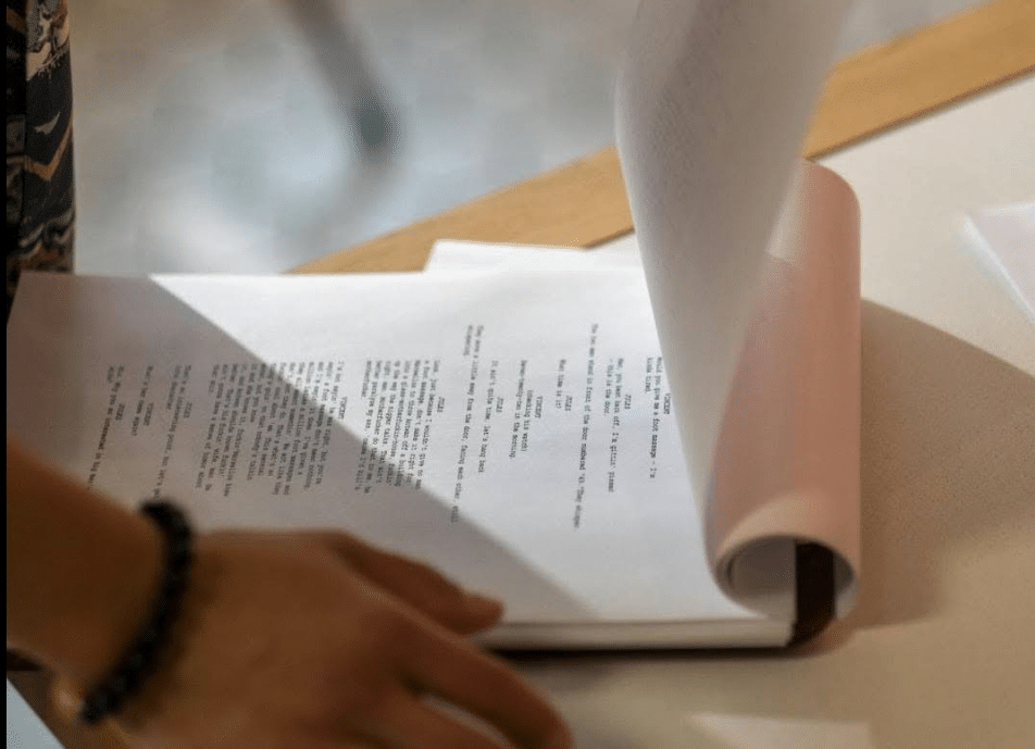 A printed out screenplay, an example of script sides, which are excerpts from a screenplay that contain only scenes to be filmed that day.