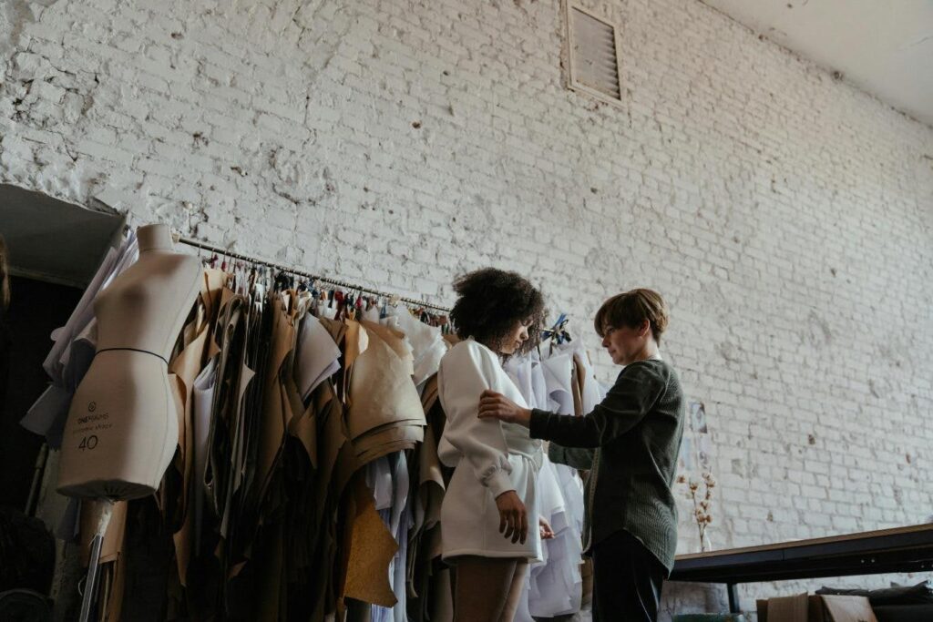 A costume designer.

The costumer designer is generally credited 6th in the closing credits of a movie.