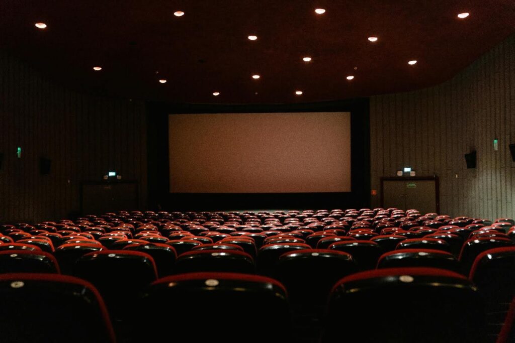 An empty movie theater about to roll the opening credits.