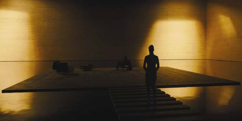 A still from the film Blade Runner. Lights and shadows add to the mood of the scene.