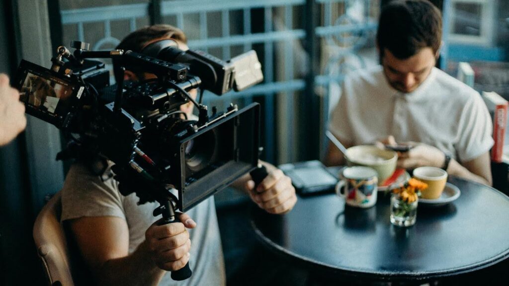 A film crew records a breakfast scene