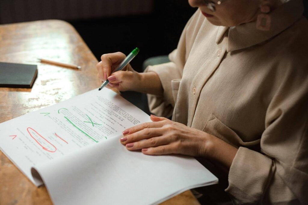 A woman editing a script