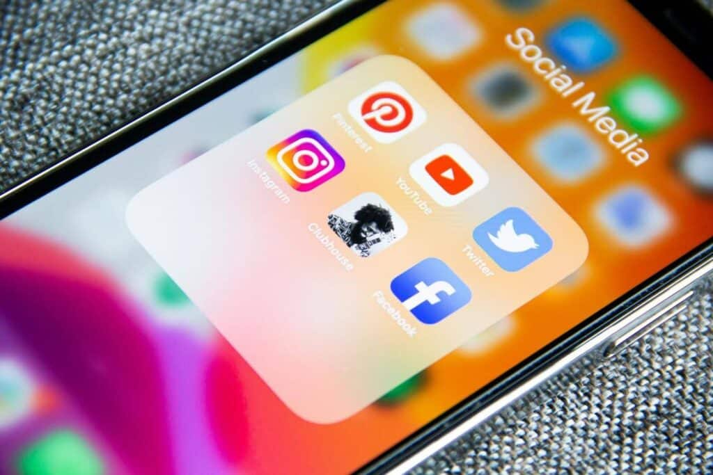 A smartphone with a folder of social media apps open