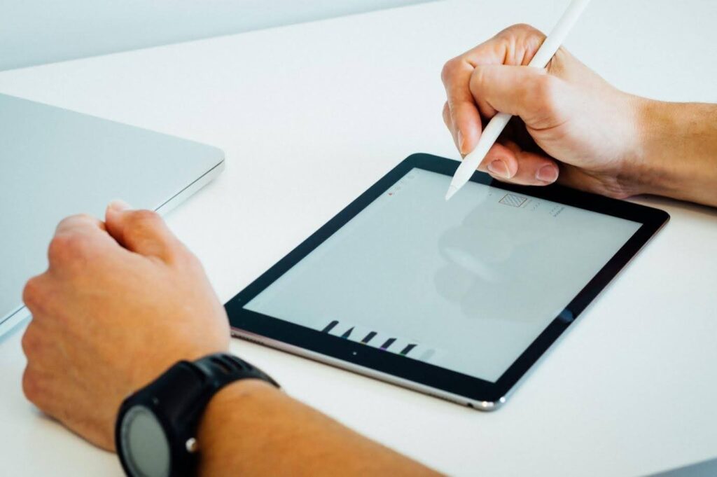 Someone working on a storyboard on a touch screen tablet (they have one of those little drawing pen things)