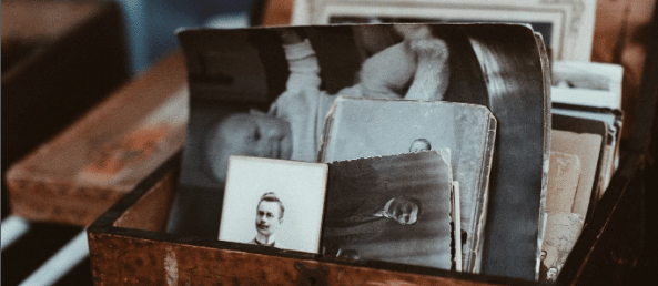 A box of old black and white photos
