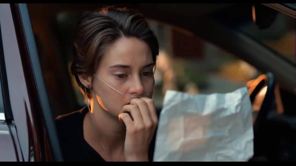 A still from The Fault in Our Stars - Hazel reads a handwritten letter.
