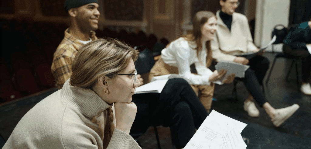 actors doing a table read of a play