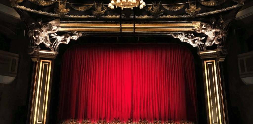 the stage of a very ornate theater