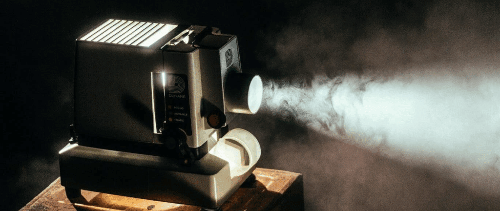 a very old film projector - you can see the dust in the air through the projection beam