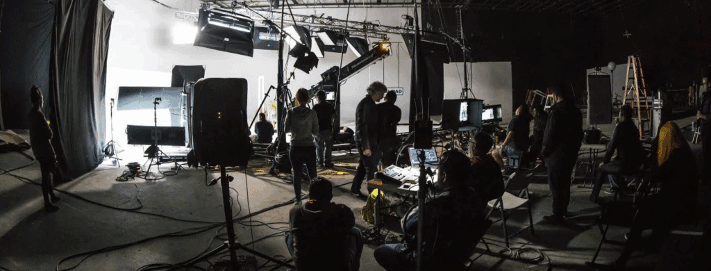 a wide shot of the production crew on a film set