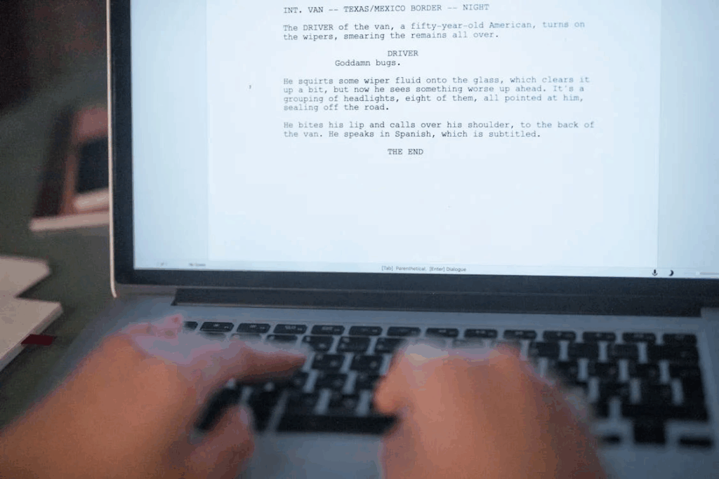 the end of a movie script on a laptop screen