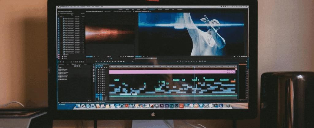 a computer monitor with film production software/film editing software on it.