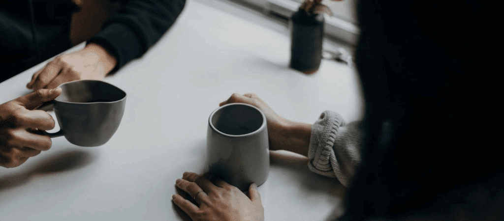 overhead photo of two people holding coffee mugs. One of them is a super weird shape.

download free movie scripts online