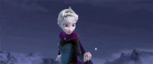 A gif of Elsa from the children's movie Frozen singing "Let it Go" - snowflakes magically come out of her hands in this gif.