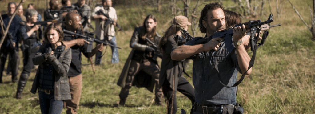 Rick, Maggie, Jesus, and crew - on the move, guns in hand.