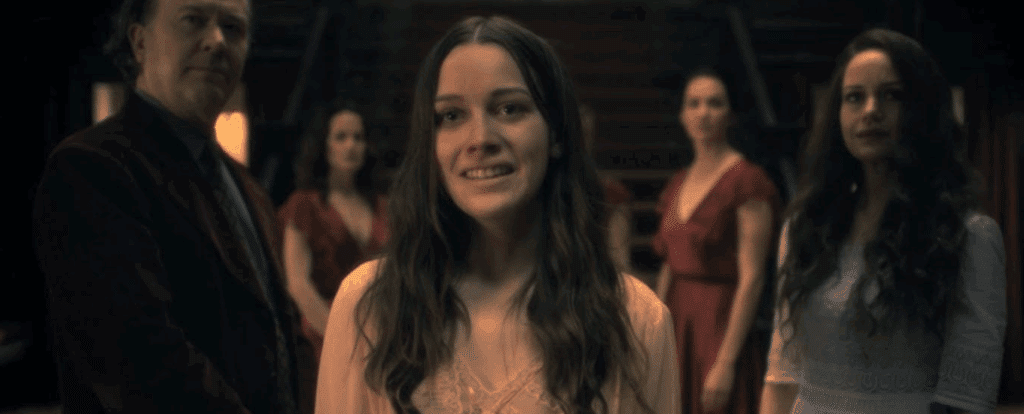 Nellie stands in front of her family in The Haunting of Hill House