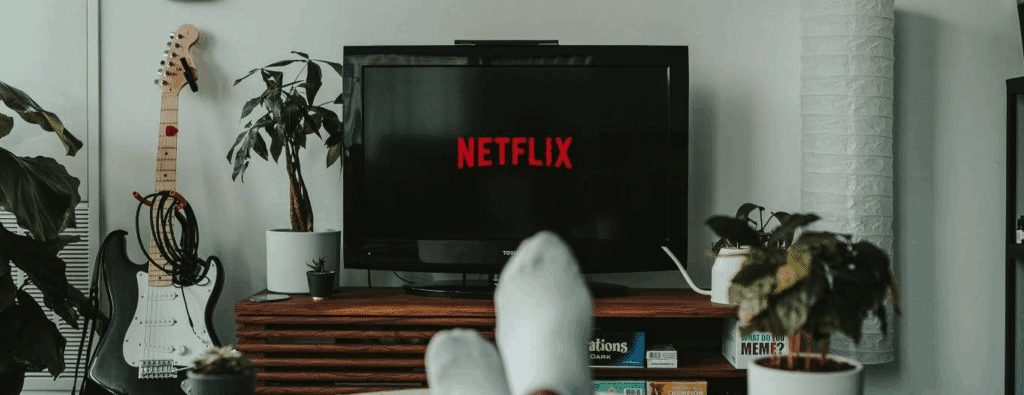 A person watching Netflix from the comfort of their own home.

Film exhibition