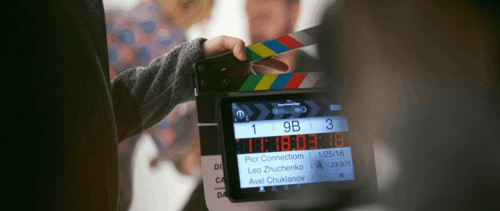 A film clapboard ready to close to signal the start of filming.