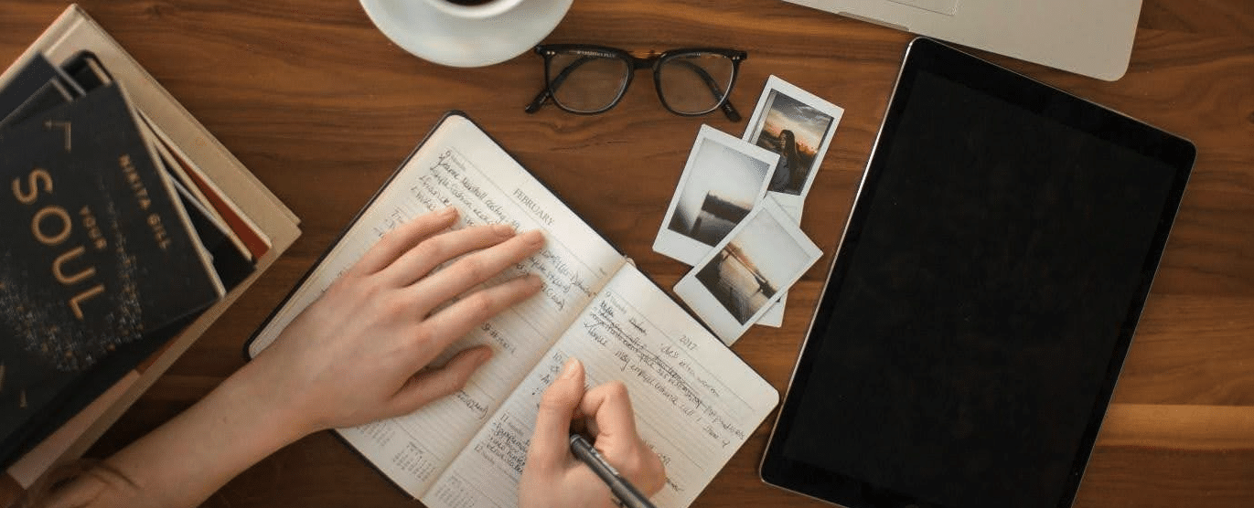 how to write internal conflict an overhead photo of a personal writing in a journey or calendar labeled February 2017.
