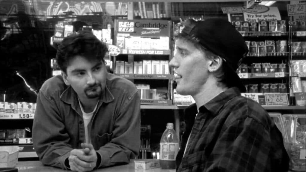 Two of the main characters from Clerks hanging out in the convenience store - which is the main setting of that story