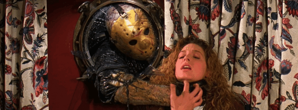 Jason busting through a window in Friday the 13th